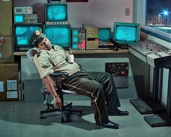 A security guard falls asleep on the job. 