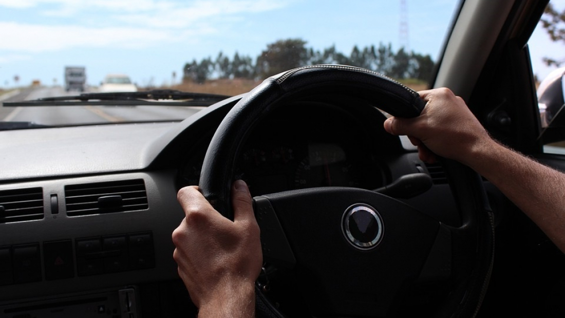 Driver driving his car safely on the road